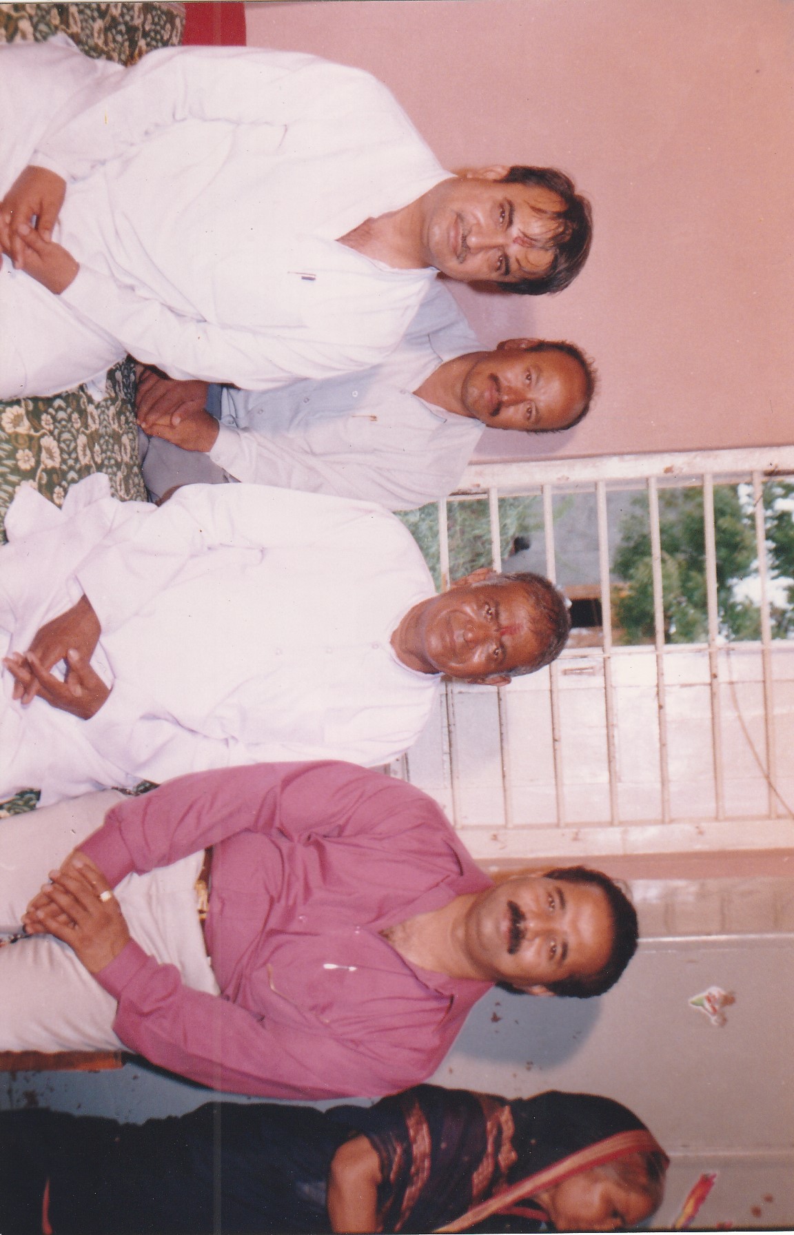 Param Pujya Shri Dhondiram Baba Chavan seated with devotees in an old archive photograph