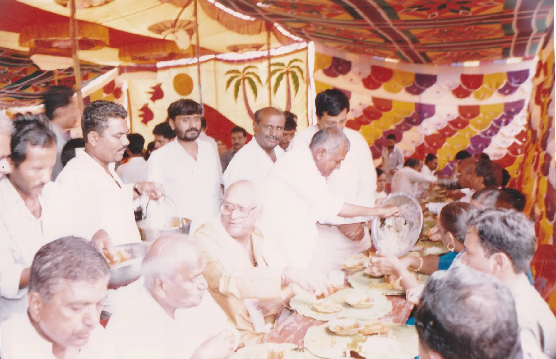 Devotees gathered for prasad during an old Saidham devotional occasion